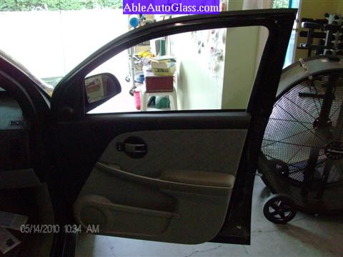Chevy Equinox 2005-2009 Front Door Auto Glass Replacement - View of Broken Glass and Door Panel