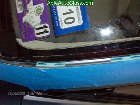Lexus IS250 2010 Windshield Replacement - blue clips lower left