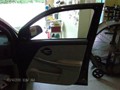 Chevy Equinox 2005-2009 Front Door Auto Glass Replacement - View of Broken Glass and Door Panel