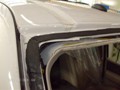 Ford Expedition-2007-2011-Acoustic-Interlayer Windshield Replacement-Clean Dirty Pinchweld with Towels and Water