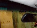 Ford F150 2005-2008 Standard Cab Windshield Repalcement - Inside View of F150 Logo Behind Rear-view Mirror